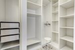 Roomy walk-in closet offers extra storage for clothing & accessories